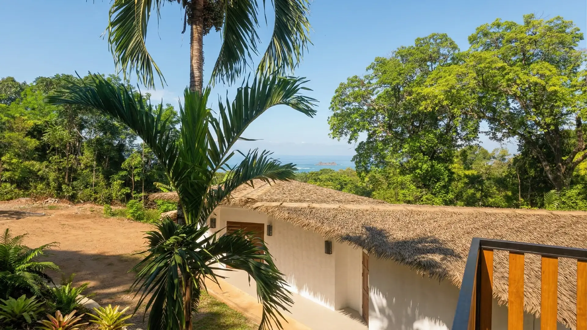 Thatched roof framing an ocean view near Uvita